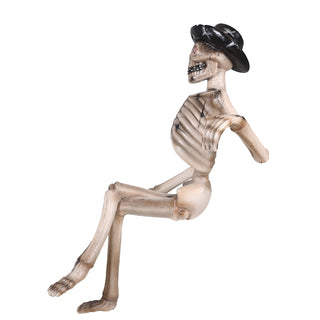 SKELETON SITTING ON A BENCH